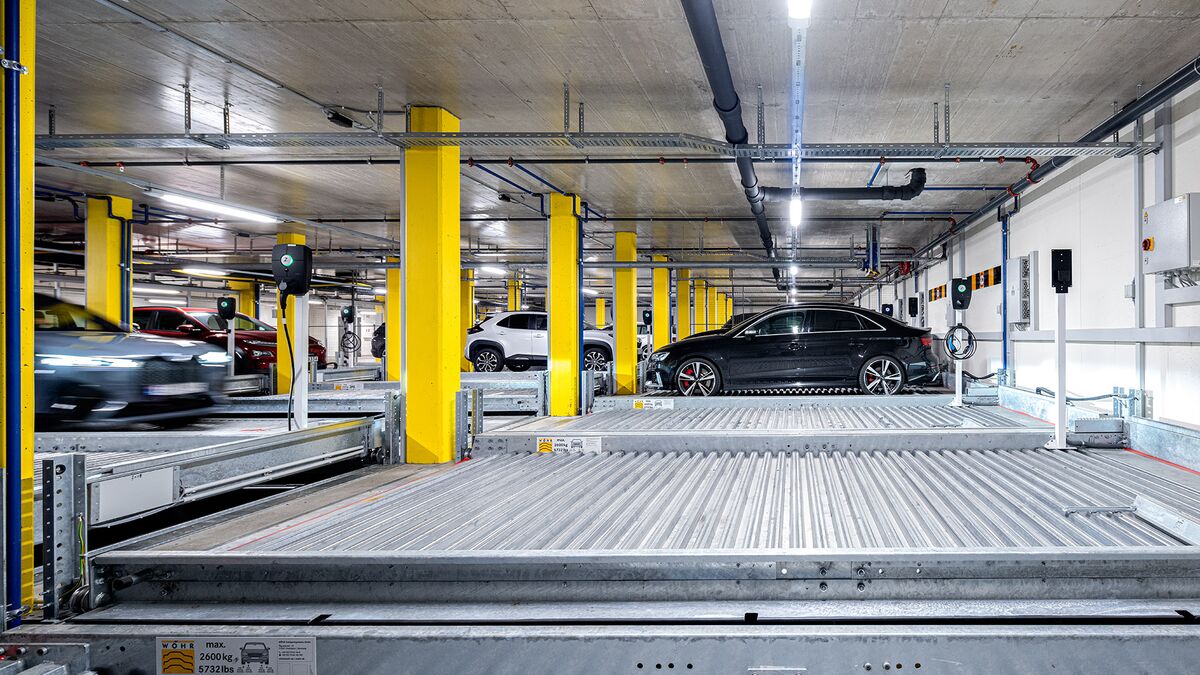 Front view of the parking systems with a car pulling in