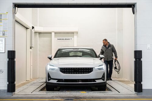 The image shows the transfer area of an automated parking system where the vehicle is parked by the driver.