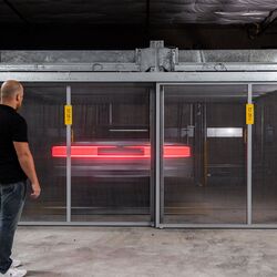 The car is being moved within the parking system