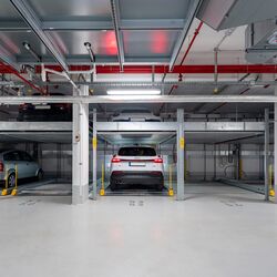 Front view of the parking system, showing a car parked in a parking space