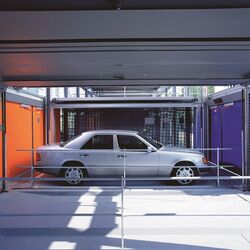 The car is waiting in the handover bay, ready to be parked