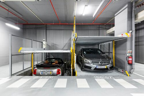 A parking system with two parked cars