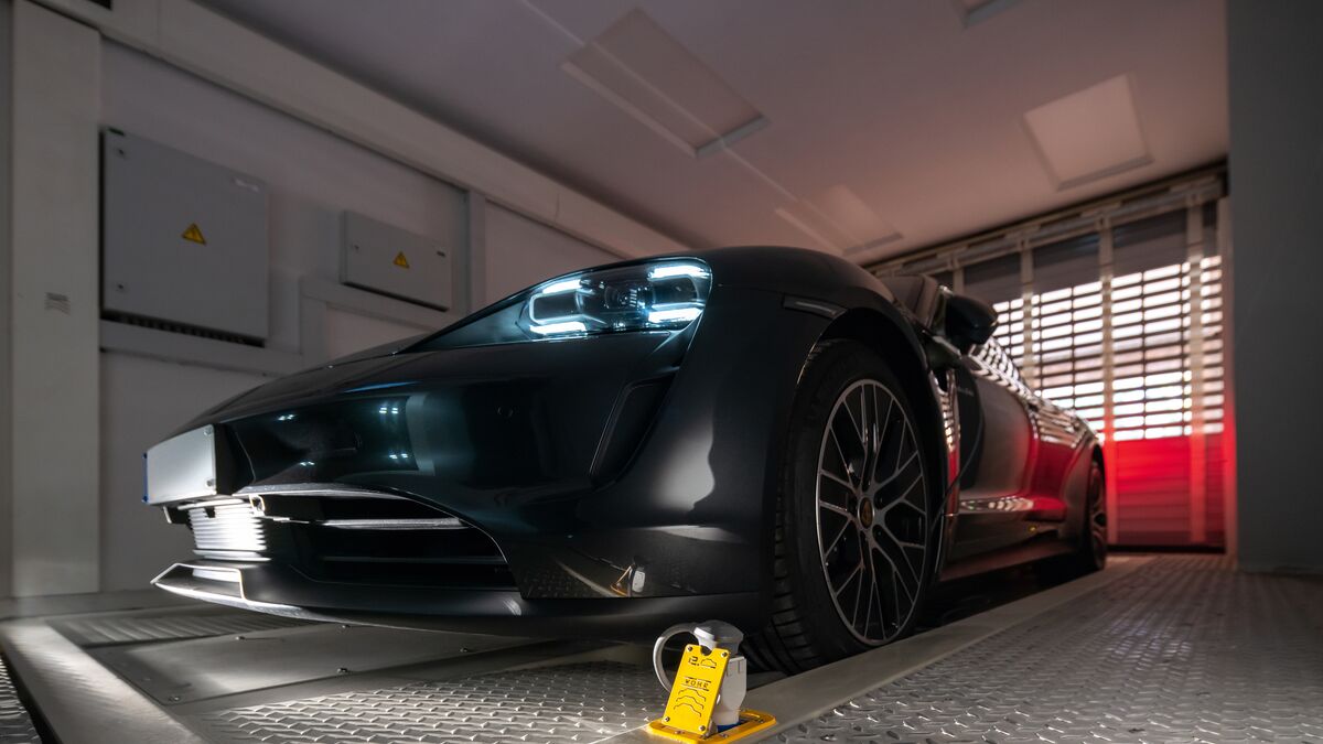 The car is parked in a parking bay on a parking platform