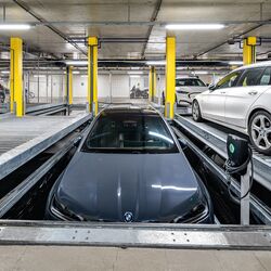 The car lowers itself into the parking position in the parking system