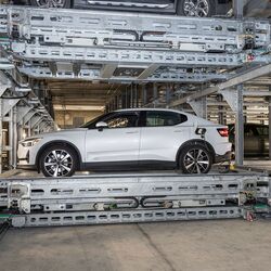 The car is parked on a parking platform within an automated parking system.