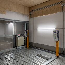 Electric charging points are located on a parking system