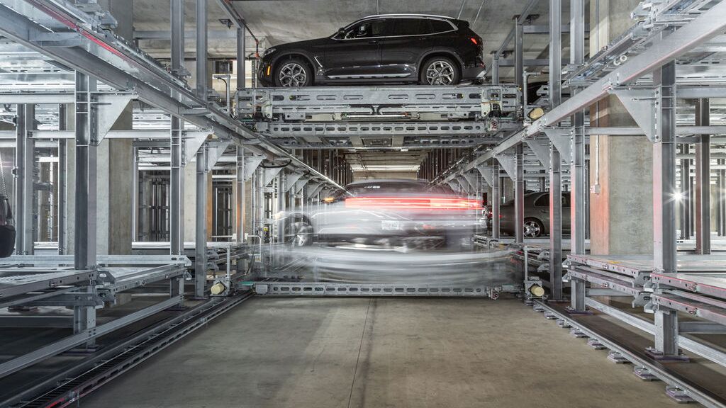 The car is parked on a parking platform within an automated parking system.