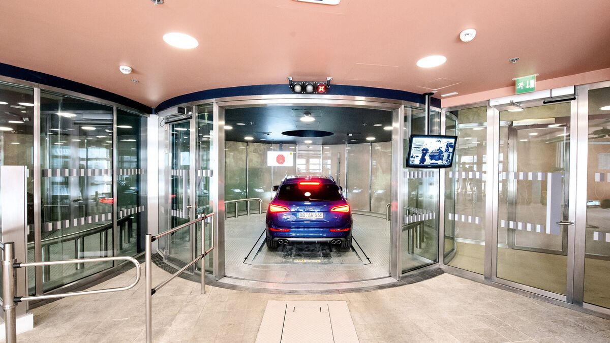 The car drives into a car parking system