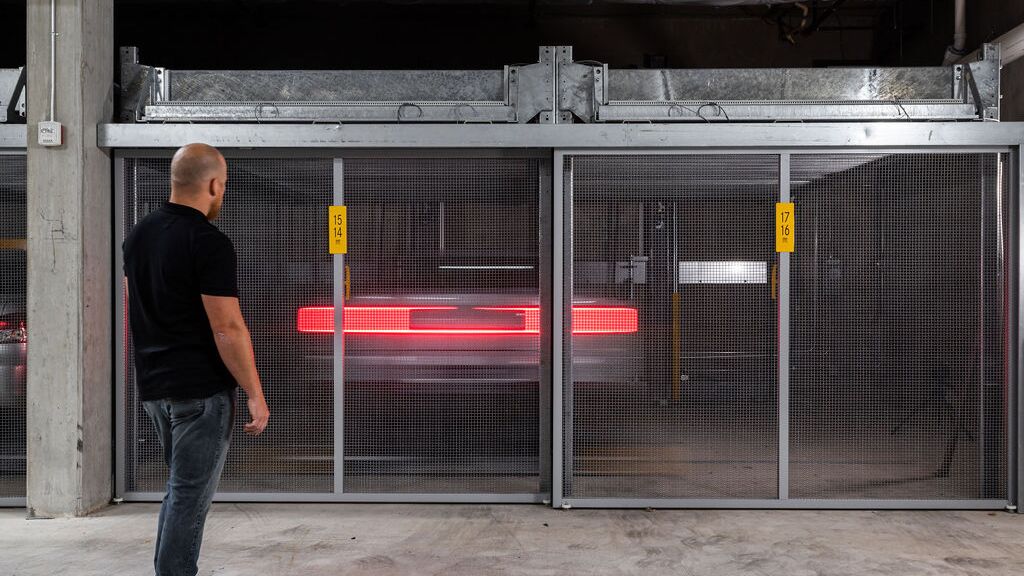 The car is being moved within the parking system