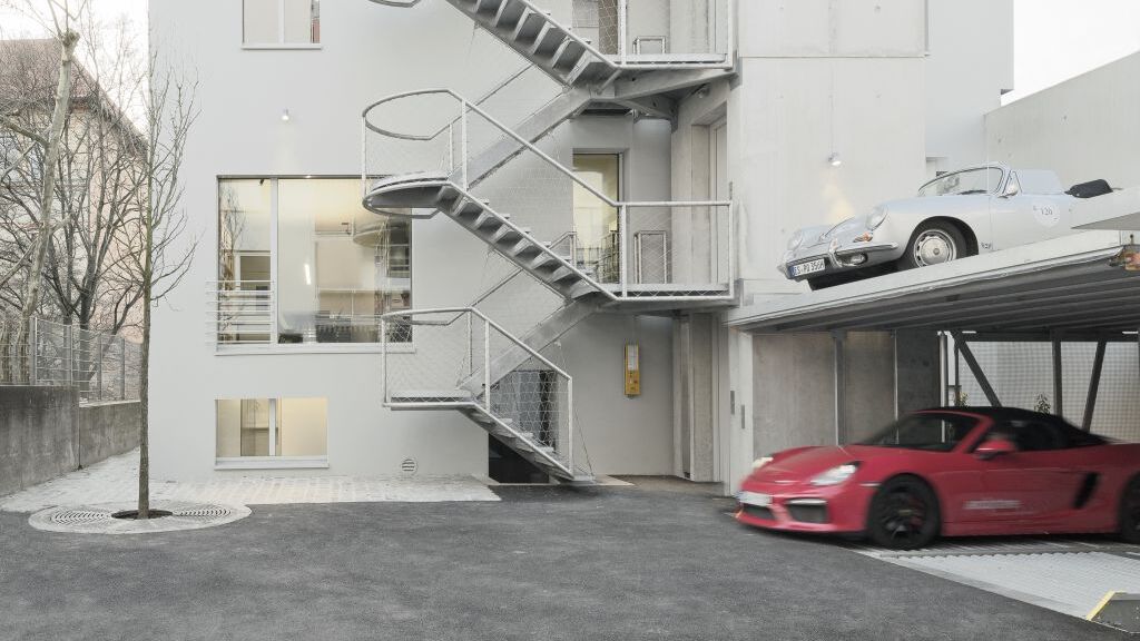A building on Olgastraße with a car parking system built in front of it